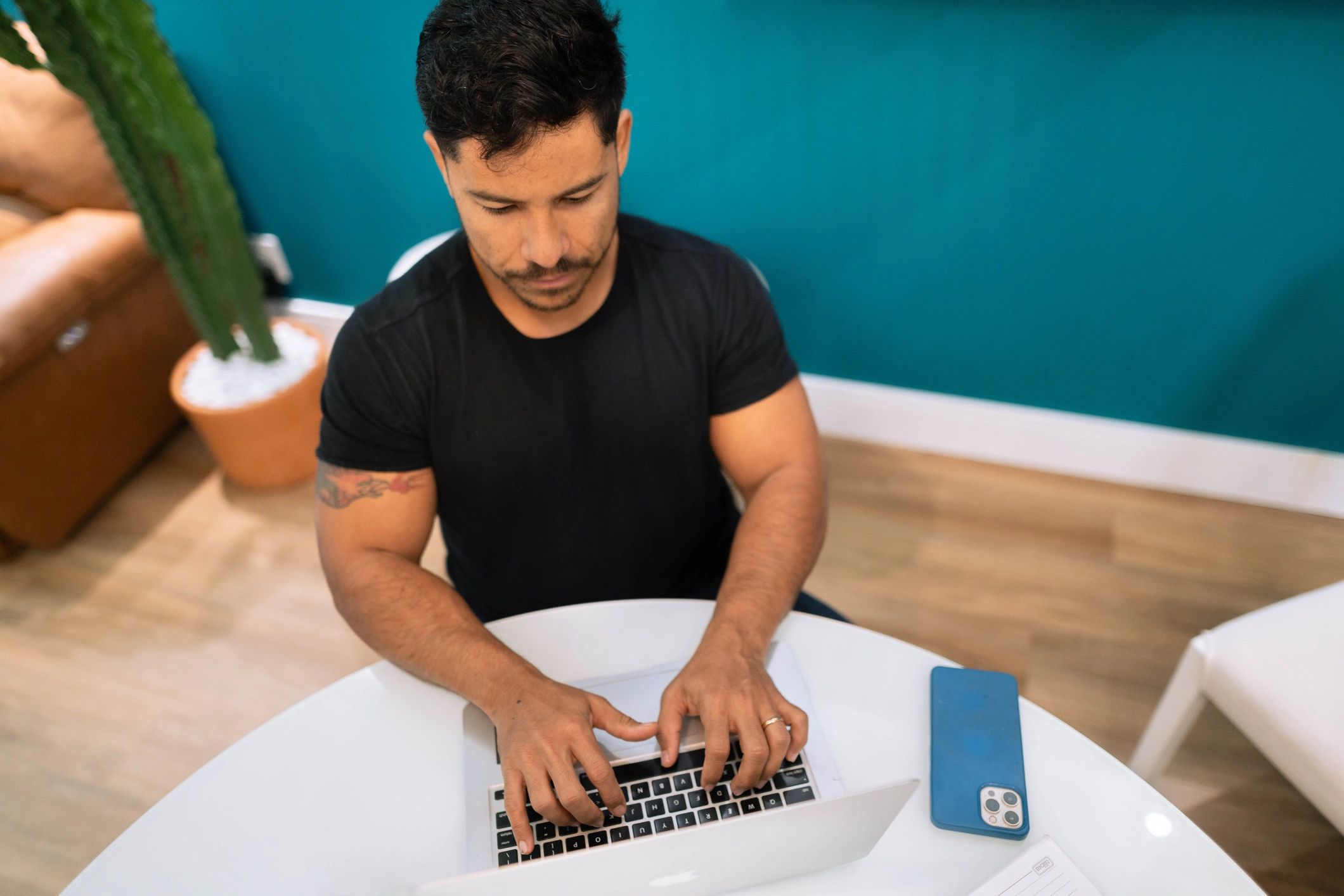 Professional working on a laptop to manage tasks and learning plans