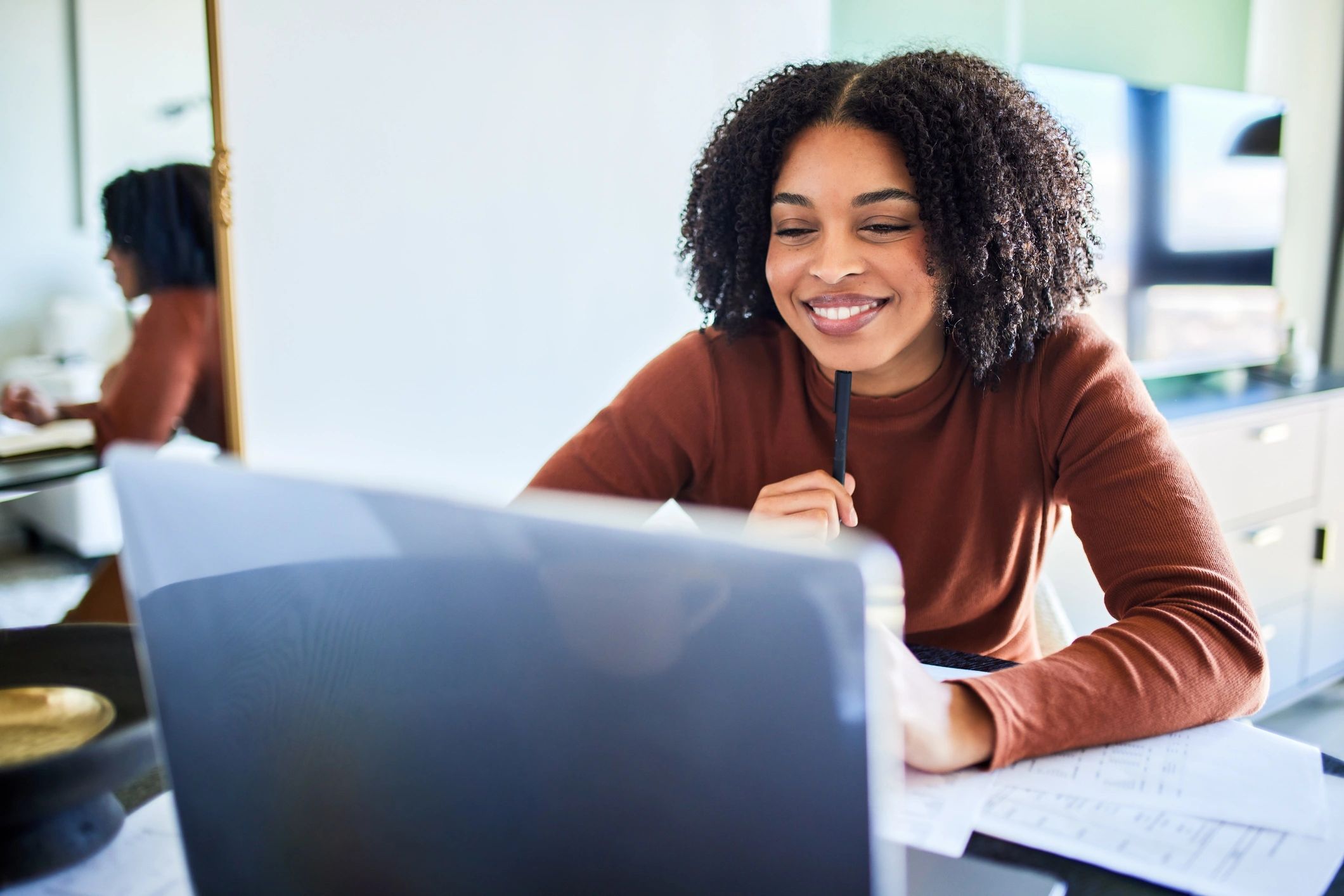 Team member working confidently at a laptop